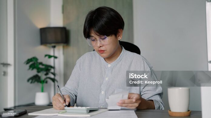Asian woman worried about expenses cost of living at home